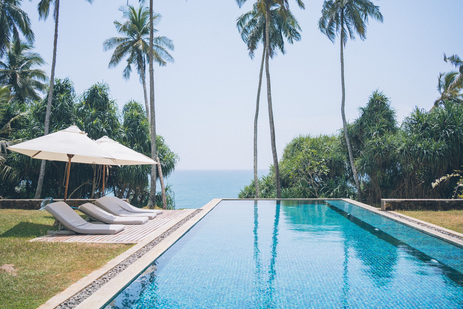 Outdoor swimming pool and sea in tropical setting