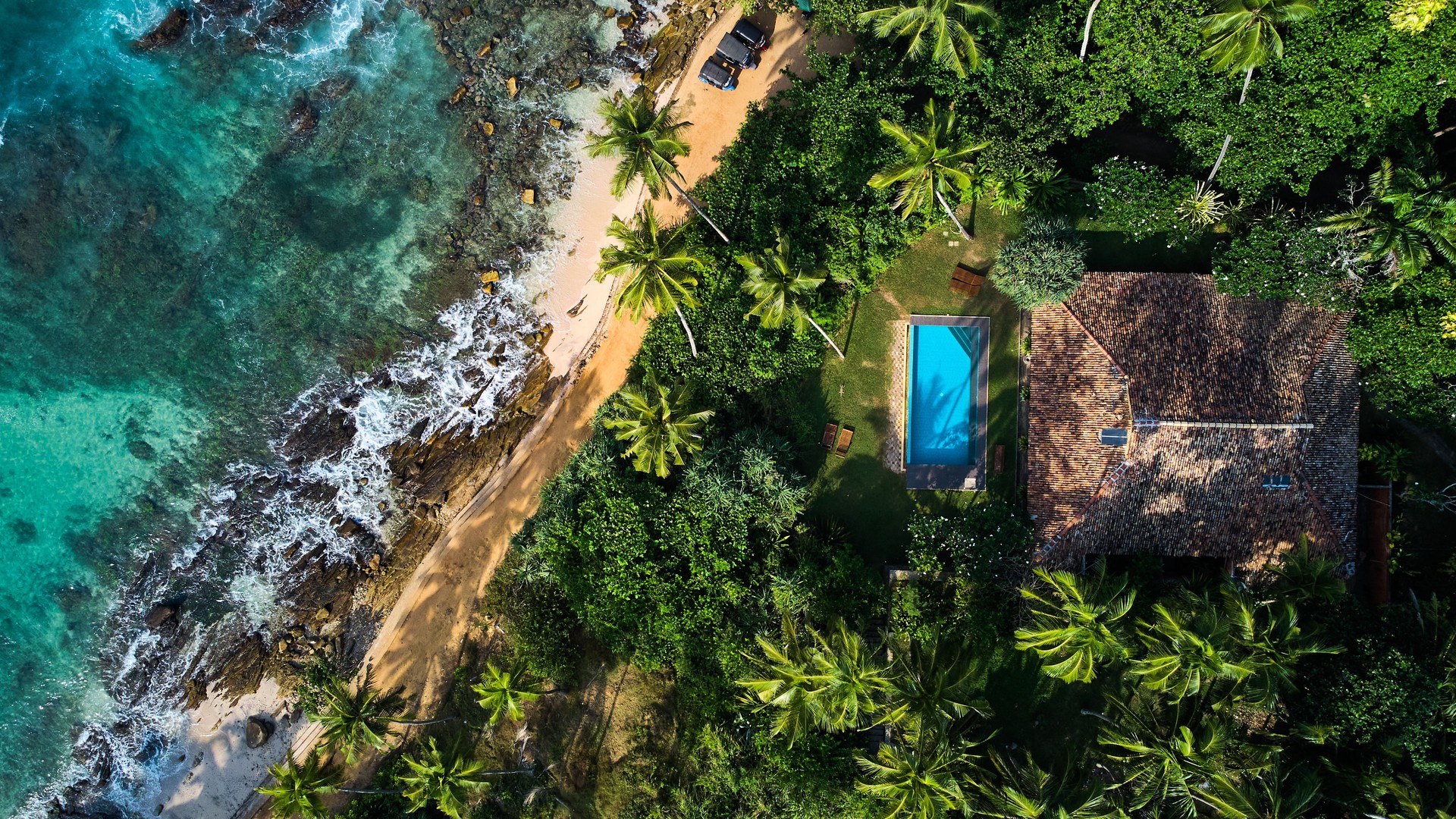 Aerial view of a villa with a swimming pool in the tropics. Hiriketiya beach, Sri Lanka