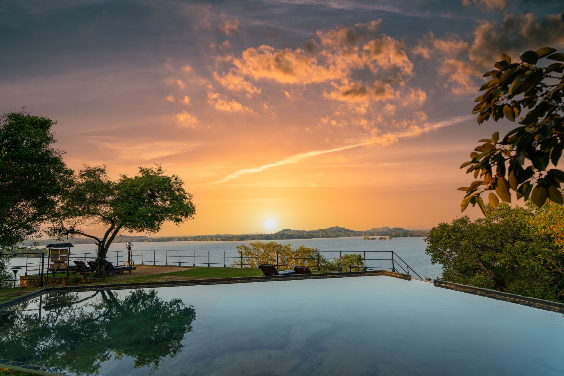 The tranquil infinity pool at Kandalama Heritage Hotel in Sri Lanka at dusk.